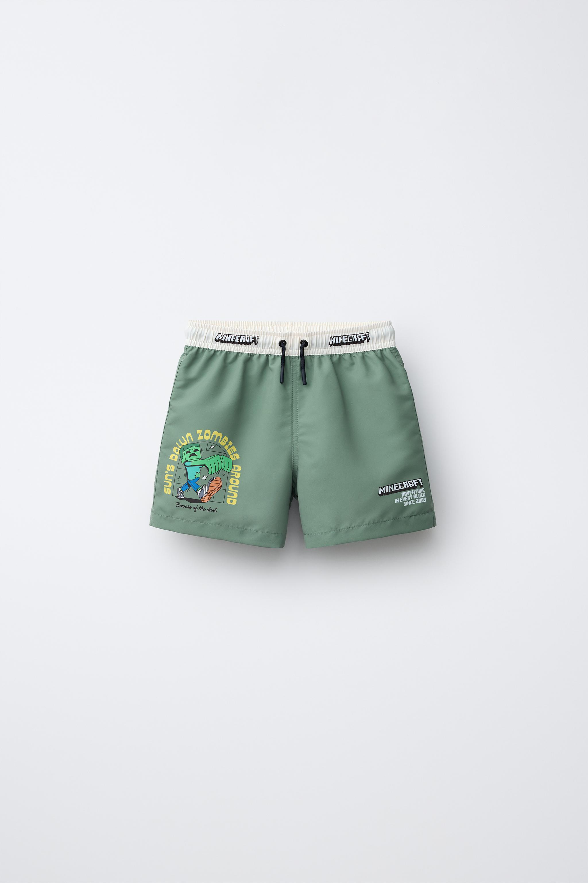 AGES 6-14 / MINECRAFT © MOJANG AB. ™ SWIM SHORTS